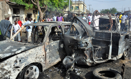 Burnt vehicles after a bomb attack in Maiduguri