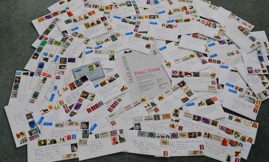 Piles of letters written on behalf on individuals at risk Piles of letters written on behalf on individuals at risk