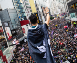 protester wearing a black Hong Kong flag © 2020 SOPA Images 