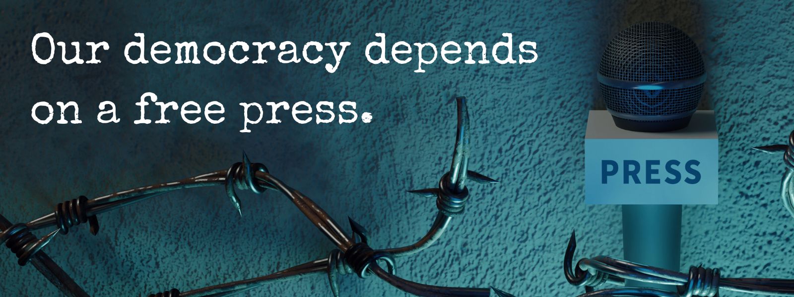 Microphone with press sign on it, next to barbed wire with text reading Our democracy depends on a free press Microphone with press sign on it, next to barbed wire with text reading Our democracy depends on a free press