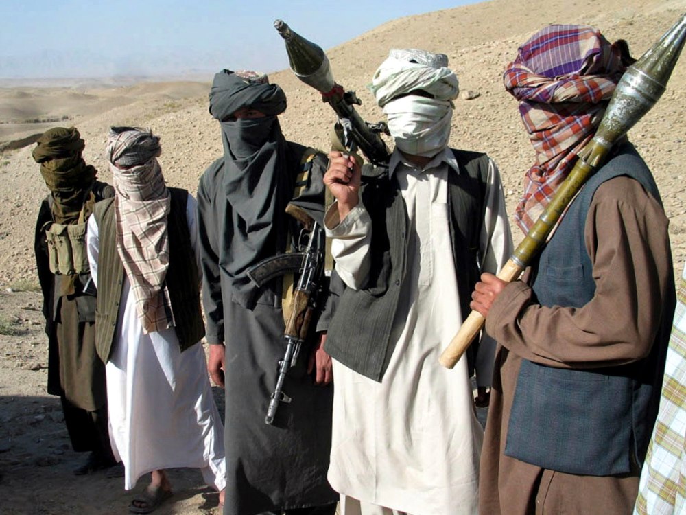 Face-covered Taliban fighters, with rocket-propelled grenade launcher and AK47 rifles, Zabul province, Afghanistan