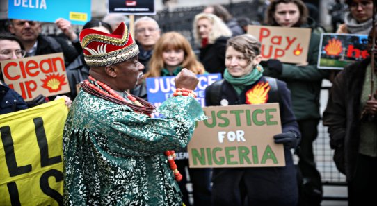 King Okpabi, ruler of Ogale, giving a speech outside the High Courts in London, UK