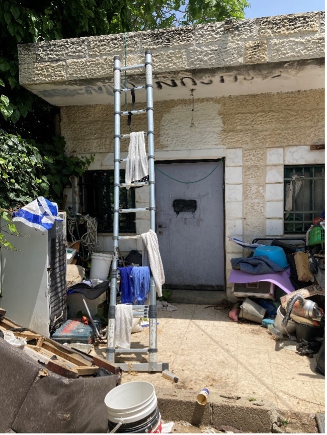 "Sheikh Jarra: The front garden with rubbish left everywhere by the settler "