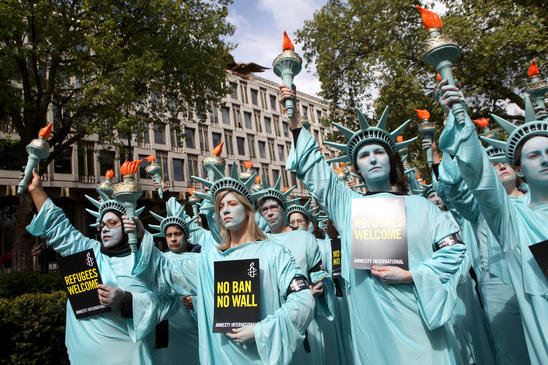 100 Statues of Liberty protest outside the US embassy with Amnesty UK