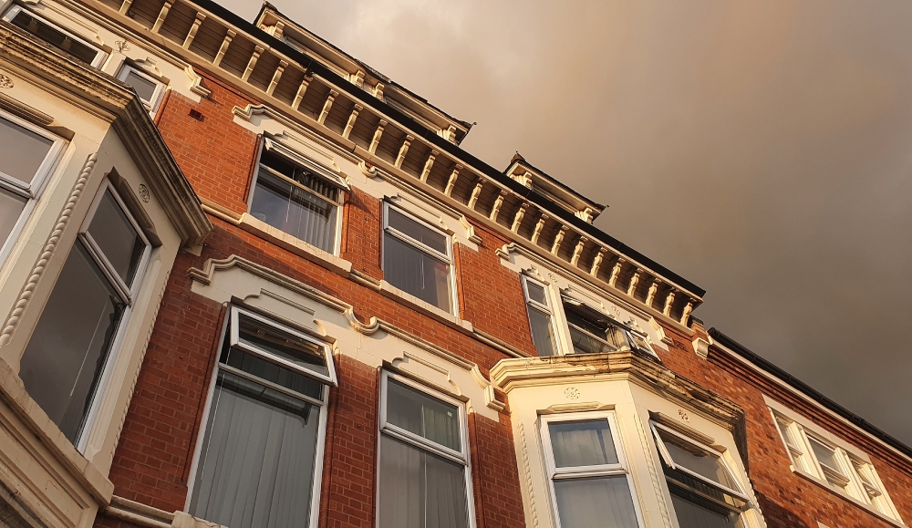Traditional townhouse against stormy clouds, Leicester, UK
