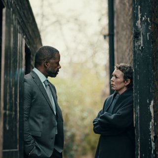 Olivia Colman and Adrian Lester looking at eachother