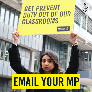 student holds a placard saying "get prevent duty out of our classrooms"