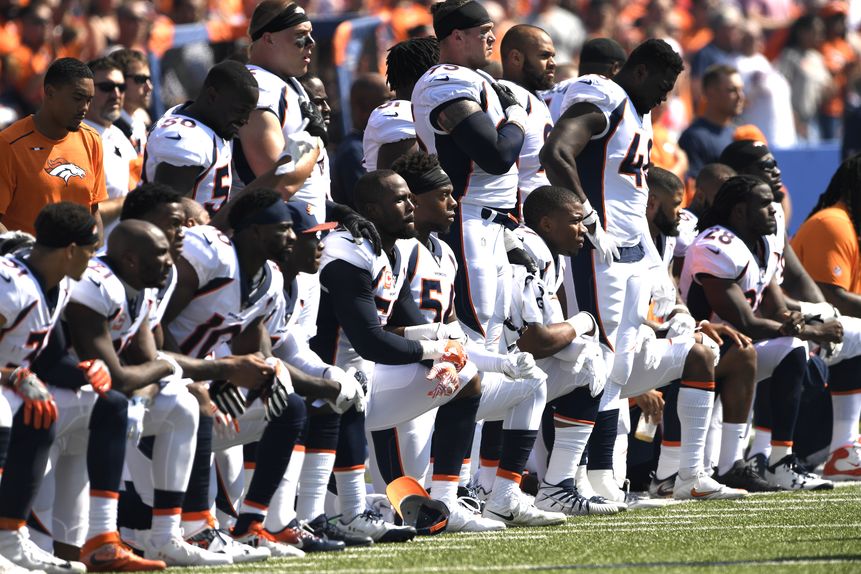 The Denver Broncos kneel before playing against the Buffalo Bills in New York, October 2017