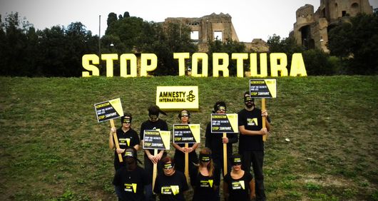 Uzbekistan Stop Torture photo action - AI Italy