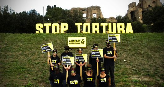 Uzbekistan Stop Torture photo action - AI Italy Uzbekistan Stop Torture photo action - AI Italy