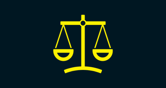 An image of yellow measuring scales on a black background to indicate justice An image of yellow measuring scales on a black background to indicate justice