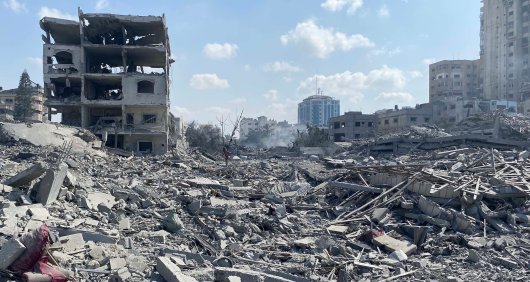 Damage of Israeli airstrikes in Gaza, with the rubble of several buildings covering the ground Damage of Israeli airstrikes in Gaza, with the rubble of several buildings covering the ground