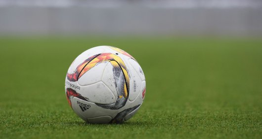 A photo of a football on a football field