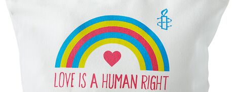 A zip pouch printed with a rainbow and 'Love is a human right'