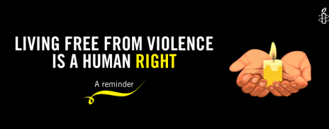 living free from violence is a human right: a reminder with hand holding a candle 