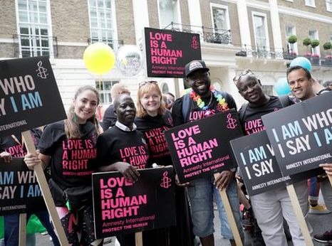 AIUK activists marching at London Pride