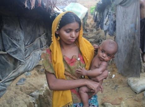 Young refugee woman with her baby
