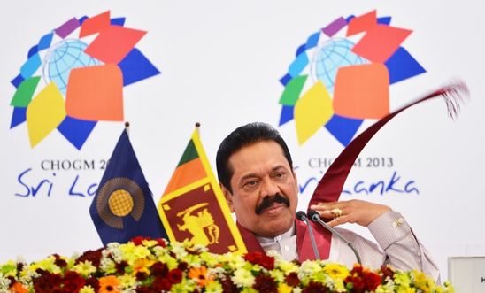 Sri Lanka President Mahinda Rajapaksa listens during a press conference.