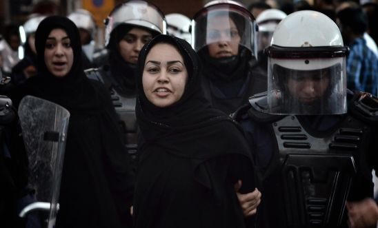 A Bahraini protester detained by riot police A Bahraini protester detained by riot police