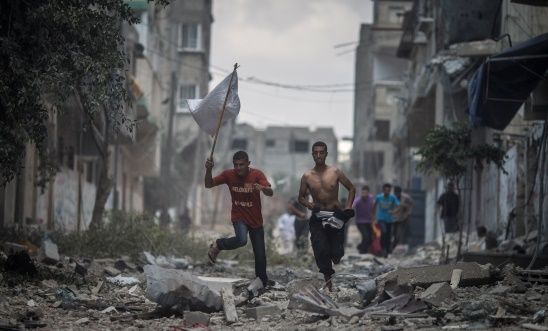 Rescue workers enter Shuja'iyya, Gaza