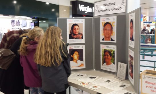 Shoppers signing Greetings cards in Watford