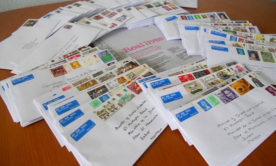 Pile of letters with colourful stamps