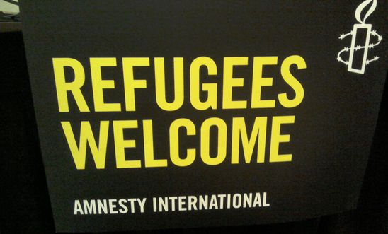 Refugees welcome Amnesty banner