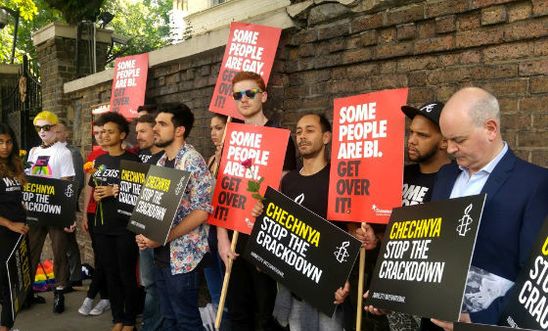 Amnesty staff standing near the Russian embassy