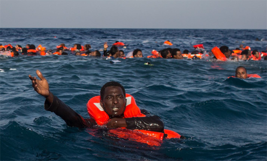 Refugees and migrants are seen swimming and yelling for assistance from crew members from the Migrant Offshore Aid Station (MOAS) 'Phoenix' vessel after a wooden boat bound for Italy carrying more than 500 people capsized on May 24, 2017 off Lampedusa, Italy.