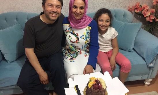 Taner Kılıç, the Chair of Amnesty Turkey, with his wife and daughter, before his arrest .