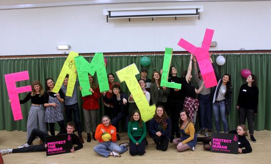 Students at the Amnesty Scotland Student Conference pose with giant letters spelling out Family to show their support for the Family Reunion Bill at Westminster