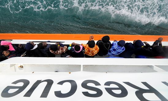 Migrants wait to disembark from Aquarius in the Sicilian harbour of Catania, Italy, May 27, 2018