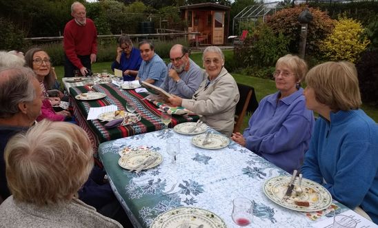 Amnesty members sitting around the supper table