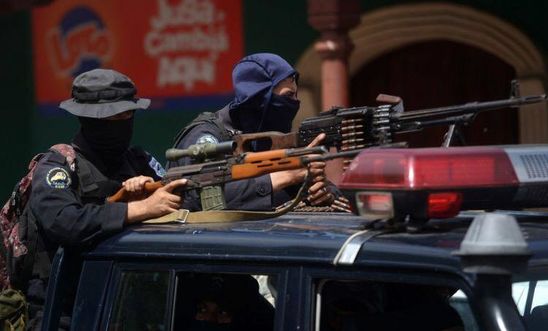 Members of the National Police armed with Dragunov riffle and a PKM machine gun in Masaya