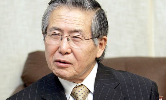 Peru's former President Alberto Fujimori answers a question during an interview with The Associated Press at his private residence