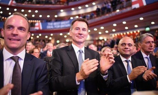 Cabinet Ministers (L-R) Dominic Raab, Jeremy Hunt, Sajid Javid and Philip Hammond clap ahead of British Prime Minister Theresa May's speech on the final day of the Conservative Party Conference at The International Convention Centre on October 3, 2018 in Birmingham, England.