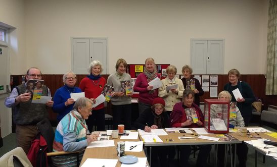 Letter writers holding up their letters