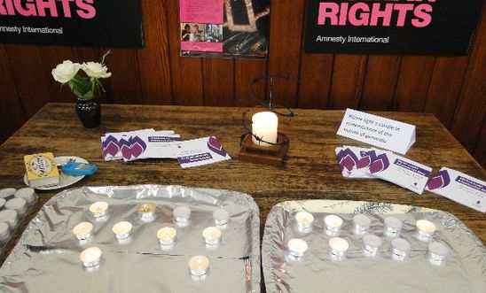 Amnesty candle, tea lights and banners
