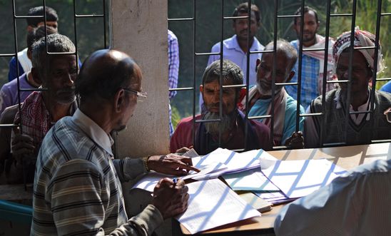 eople wait to check their names on the first draft of the National Register of Citizens (NRC) at Goroimari of Kamrup district in the Indian state of Assam on January 1, 2018