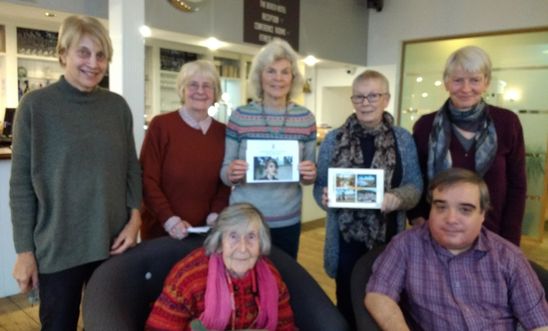 Amnesty members holding a greetings card