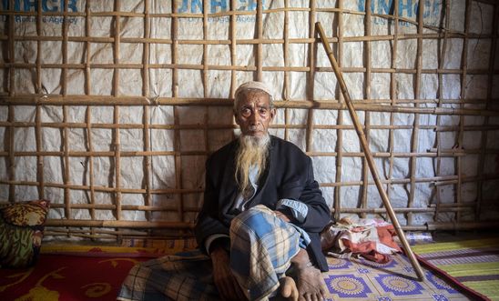 Abul Hossain, around 85 years old, sits in his shelter in Camp #1 West (Kutupalong Camp), Bangladesh, 19 February 2019