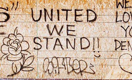 Graffiti that reads: United We Stand Graffiti that reads: United We Stand