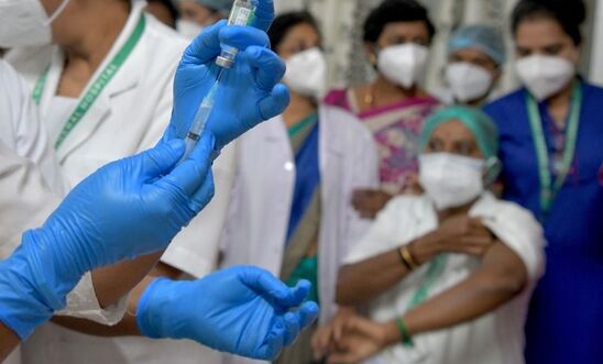 Picture of a doctor administering a vaccine to a patient