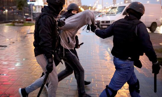 Three armed police detain an unarmed, peaceful protester in Belarus Three armed police detain an unarmed, peaceful protester in Belarus