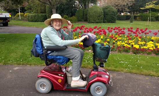 Amnesty member on her scooter