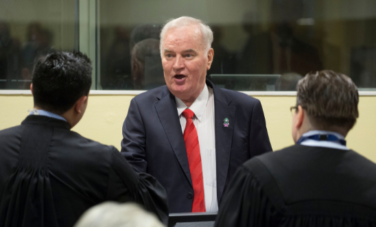 Former Bosnian military chief Ratko Mladić speaks to his lawyers before appearing for the pronouncement of the Trial Judgement for the International Criminal Tribunal for the former Yugoslavia (ICTY) on November 22, 2017 in The Hague. Former Bosnian military chief Ratko Mladić speaks to his lawyers before appearing for the pronouncement of the Trial Judgement for the International Criminal Tribunal for the former Yugoslavia (ICTY) on November 22, 2017 in The Hague.
