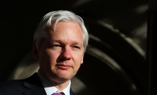 WikiLeaks founder Julian Assange speaks to the media outside the High Court in London on December 5, 2011 