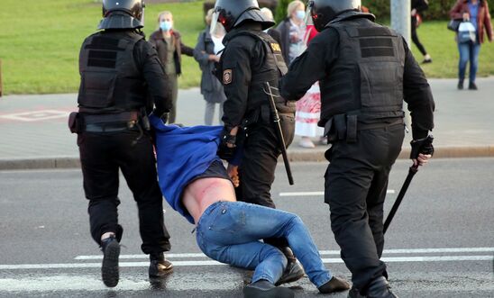 Riot police officers detain a man during an opposition rally to protest against the presidential inauguration in Minsk on September 23, 2020 Riot police officers detain a man during an opposition rally to protest against the presidential inauguration in Minsk on September 23, 2020