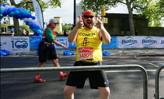 Runner turns to camera and points Runner turns to camera and points