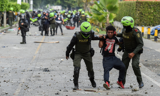 Colombian police officers arrest a demonstrator during a protest against the government in Cali, Colombia, on 4 June, 2021 Colombian police officers arrest a demonstrator during a protest against the government in Cali, Colombia, on 4 June, 2021